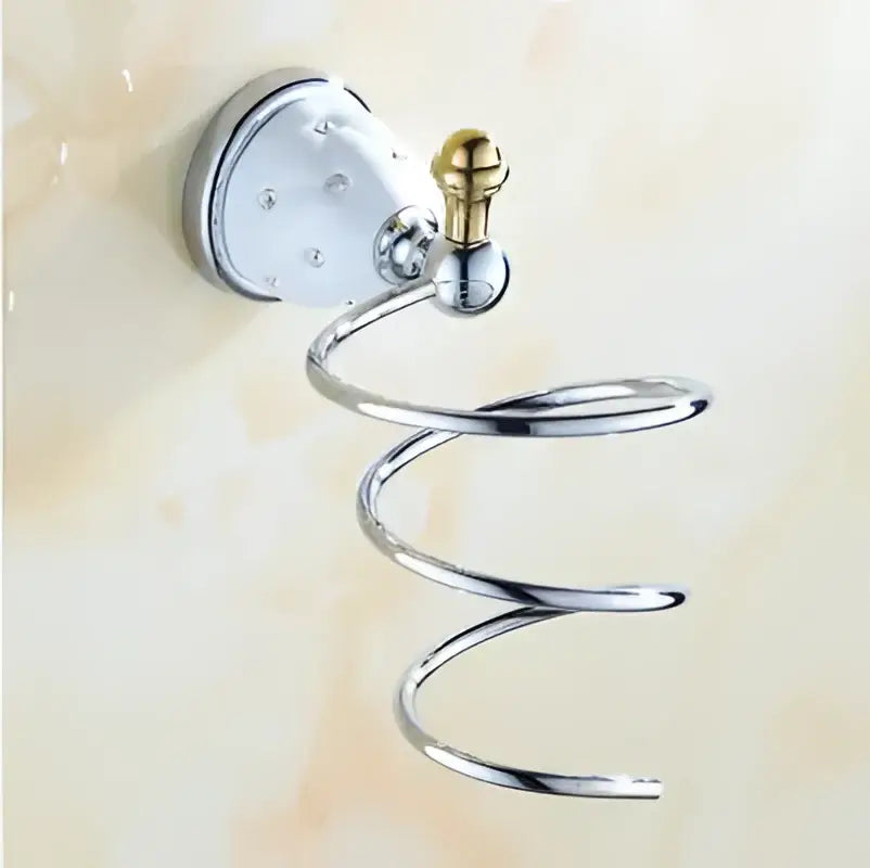 Chrome finished spiral towel rack with gold toned ceramic knob and circular mount from decorbites bathroom hardware set