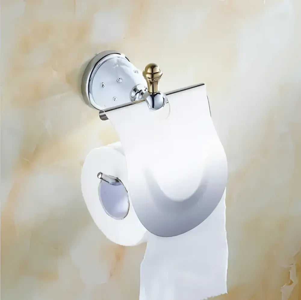 Chrome finished toilet paper holder with decorative gold toned knob and clear acrylic cover in decorbites bathroom hardware set