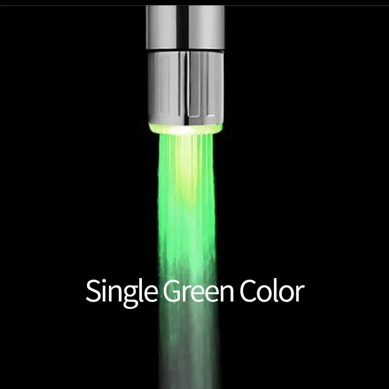 Chrome led faucet aerator with a sleek chrome finish emitting a vibrant green light for kitchen water saving