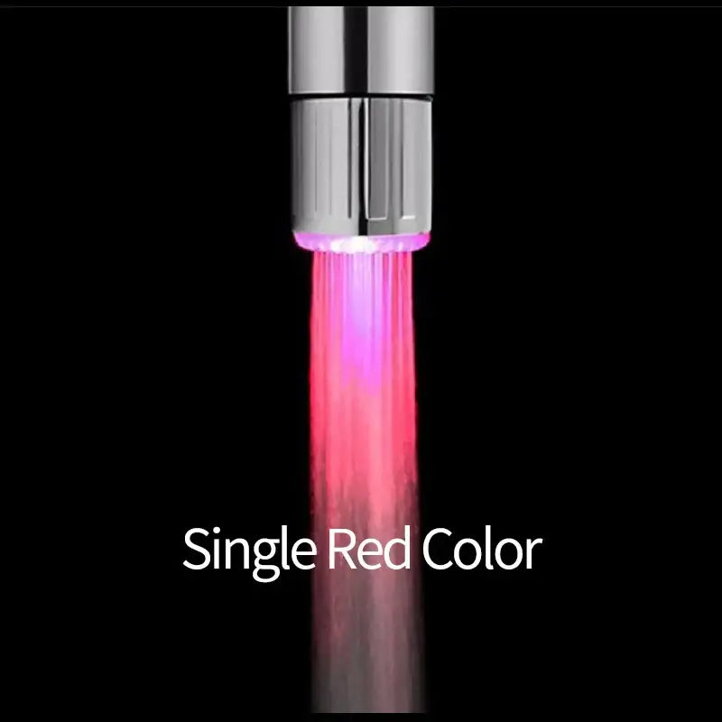 A chrome led faucet aerator with a sleek finish emitting vibrant red light for kitchen water saving use