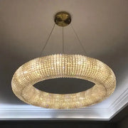 Chrome round crystal chandelier featuring clear faceted crystals on a ring frame for elegant living room lighting