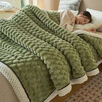 Soft moss-green coral fleece blanket with textured pattern and white trim bedroom throw for cozy use