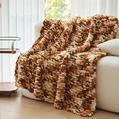 Cozy chunky knitted jacquard blanket throw in caramel cream and brown tones for living room decor