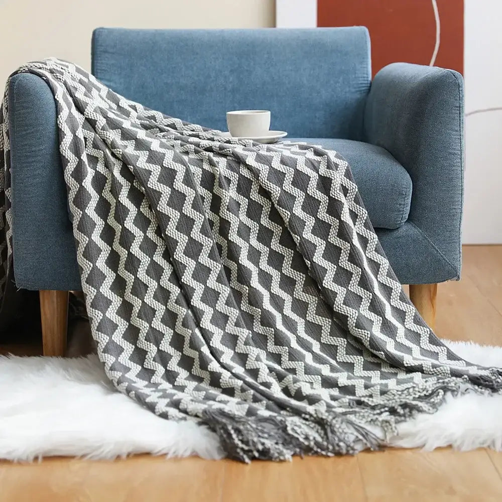 Gray and white zigzag-patterned knit throw blanket with fringed edges cozy knitted sofa blanket for living room decorbites cozy knitted