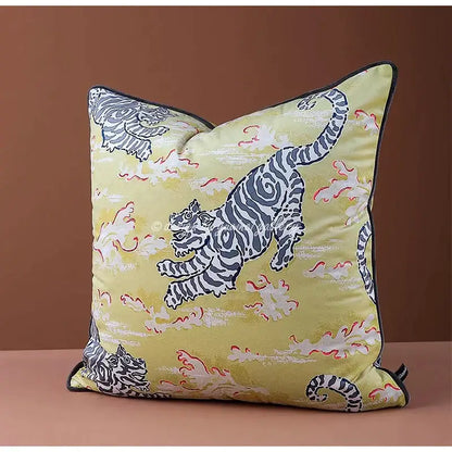A pale yellow cushion cover with bold black and white tiger illustrations and red accents on textured fabric for living room decorbites circus horse print