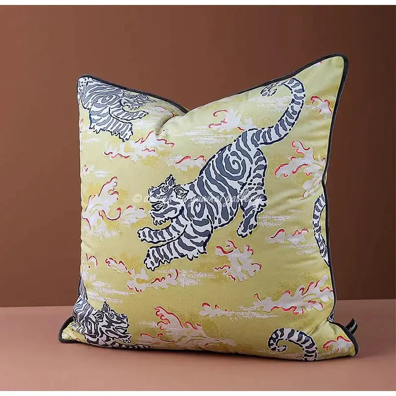 A pale yellow cushion cover with bold black and white tiger illustrations and red accents on textured fabric for living room decorbites circus horse print