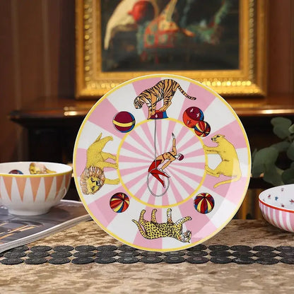 Vibrant pink and white ceramic tableware set with acrobat and wild animals decorbites circus troup kids design