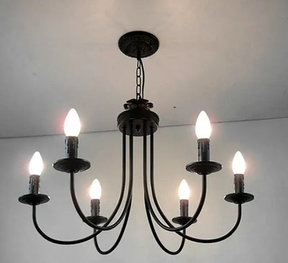Classic black curved arm chandelier with five candle-style bulbs in black wrought iron for dining room decorbites black curved arm lighting