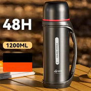 Classic black and red vacuum thermos flask with insulated body and integrated handle for outdoor use