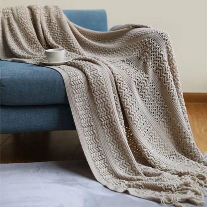 Beige knitted throw blanket with textured herringbone and braided patterns for cozy decorbites houndstooth throw use