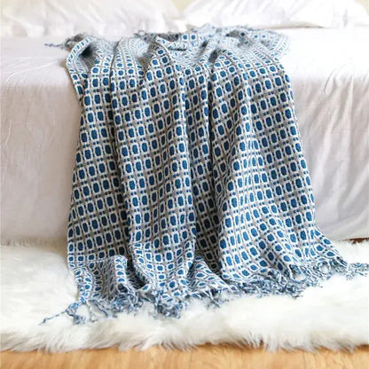Blue and gray woven decorbites houndstooth throw blanket with geometric pattern and fringed edges for living room decor