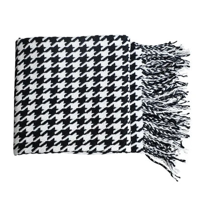 Classic black and white houndstooth throw blanket with fringed ends by decorbites for stylish living room decor