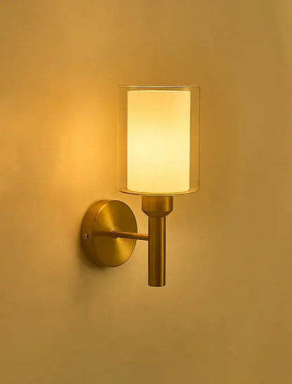 Classic brass glass wall sconce with frosted cylindrical shade for bedroom decorbites brass glass wall lighting