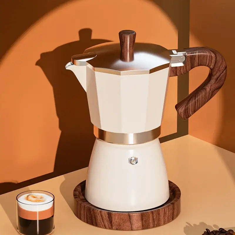 Cream-colored classic coffee machine moka pot with wooden handle and metallic bands for kitchen coffee brewing