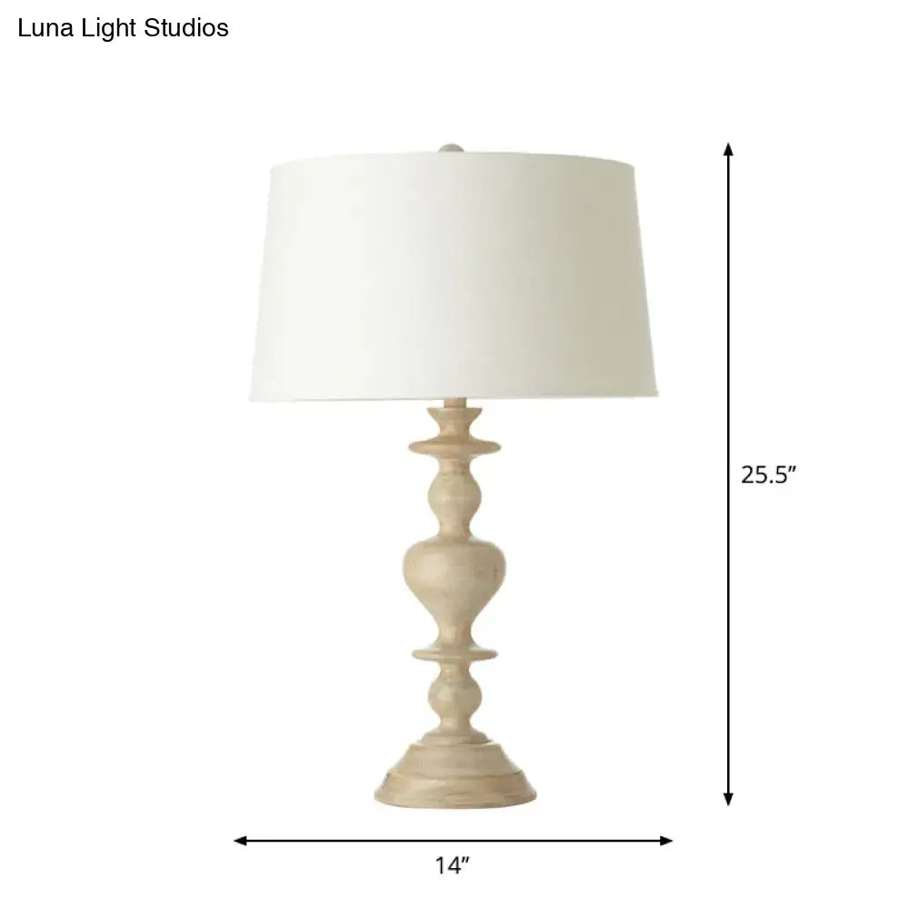 A cream-colored decorbites™ nightstand lamp with a white fabric shade and resin base suitable for 220v-240v use