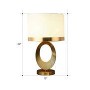 Gold-toned DecorBites™ classic drum shade table lamp with off-white fabric shade and oval ring base for 220v-240v led use