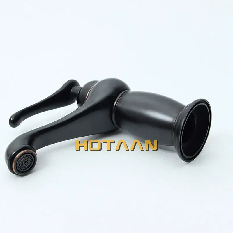 Classic matte black brass basin faucet with sleek curved spout and copper accents for black brass bathroom decorbites style