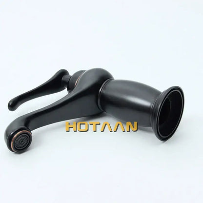 Classic matte black brass basin faucet with sleek curved spout and copper accents for black brass bathroom decorbites style