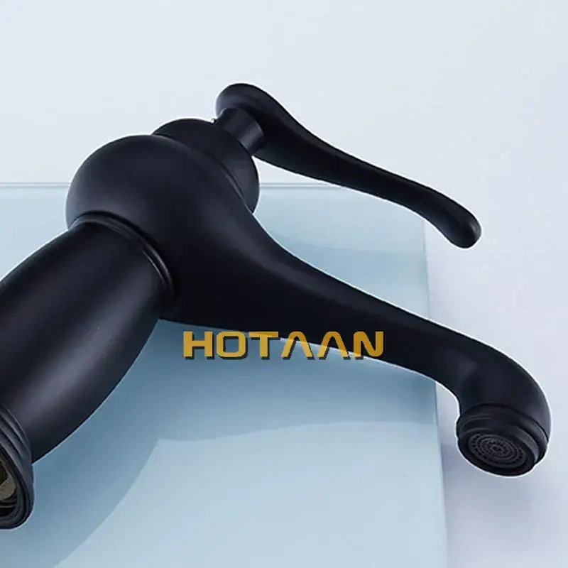Classic matte black brass basin faucet with curved spout and ergonomic lever handle for black brass bathroom decorbites