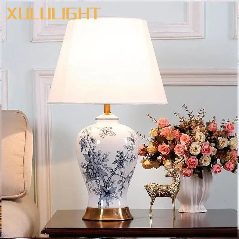 Classic white and black porcelain table lamp with hand-painted floral design and gold-toned base for living room decor