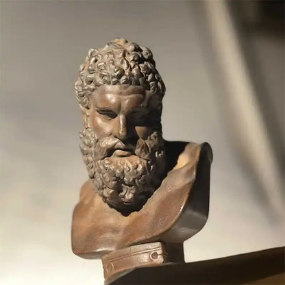 Bronze-colored classical bust sculpture hercules with detailed curly hair and beard on decorative base decorbites art sculpture
