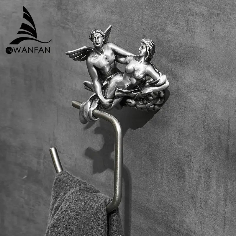 Antique silver-toned metal toilet paper holder with detailed cupid and psyche design in decorbites bronze towel style