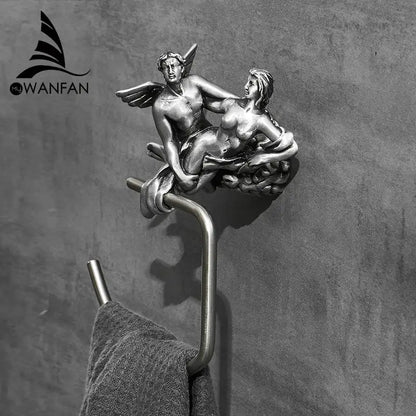 Antique silver-toned metal toilet paper holder with detailed cupid and psyche design in decorbites bronze towel style