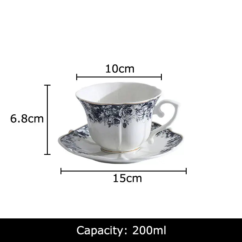 Elegant white ceramic cup and saucer set with grey blue rose black floral patterns and gold-trimmed rim for dining room use