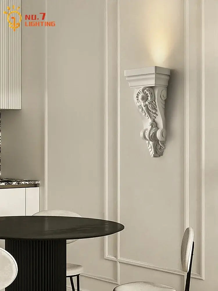 Classical ornate white cream resin wall lamp with floral and scrollwork decorbites cream resin wall sconce detailing