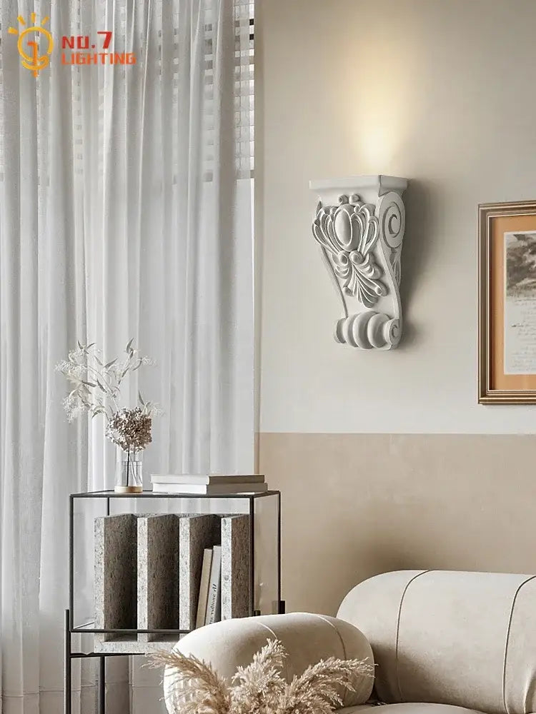 White ornate cream resin wall lamp with classical scrollwork design for living room decorbites cream resin decor