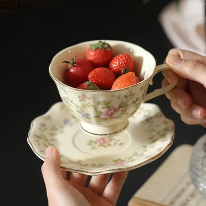 Cream-colored classical ceramic cup and saucer set with pink, purple, and green floral patterns for dining room decor