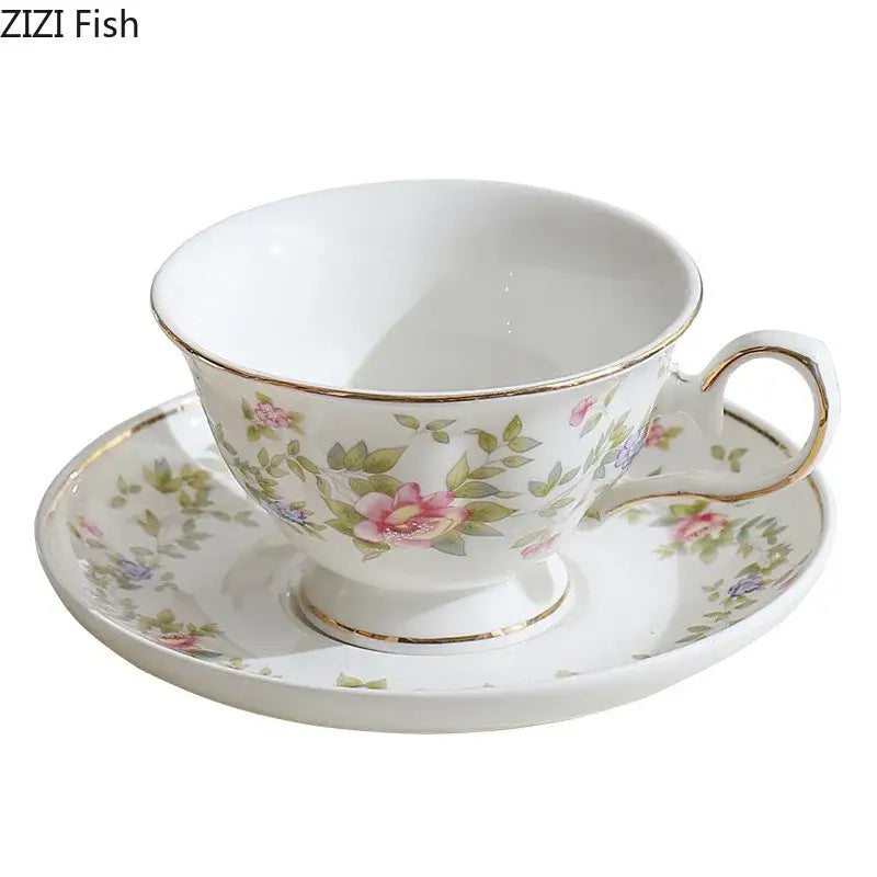 Classical ceramic cup and saucer set in white porcelain with pink rose floral patterns and gold trim for dining decor