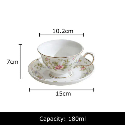Classical ceramic cup and saucer set in white porcelain with pink rose pattern and gold trim for dining room decor