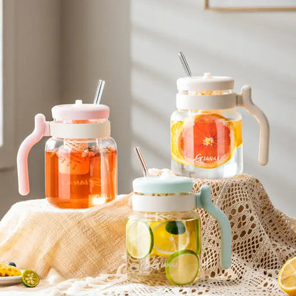 Three clear glass tumblers 1000ml with colorful silicone handles and lids filled with infused water decorbites 1000ml glass