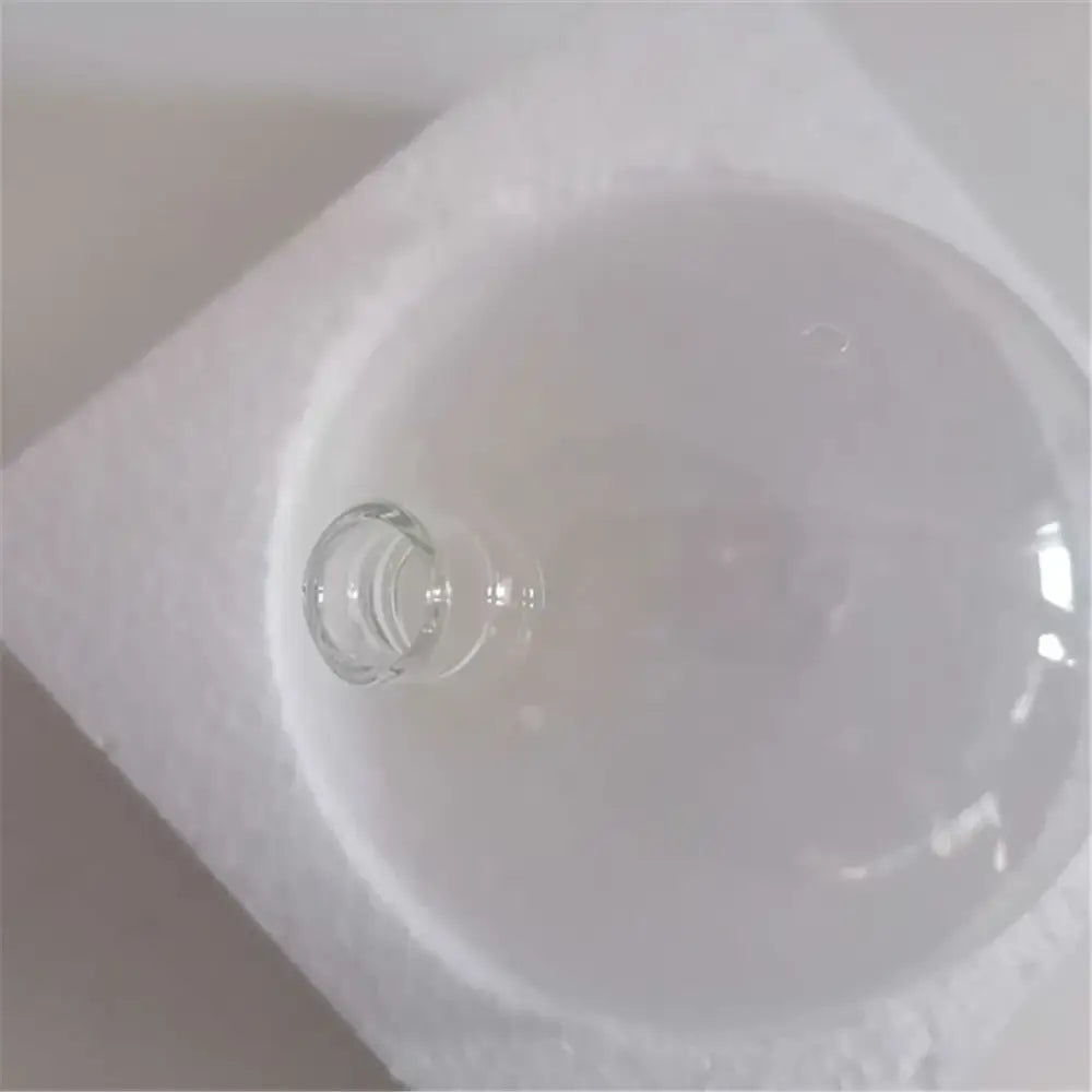 Clear glass lamp shade with 11mm opening resting on white foam padding for decorbites living room ornament set