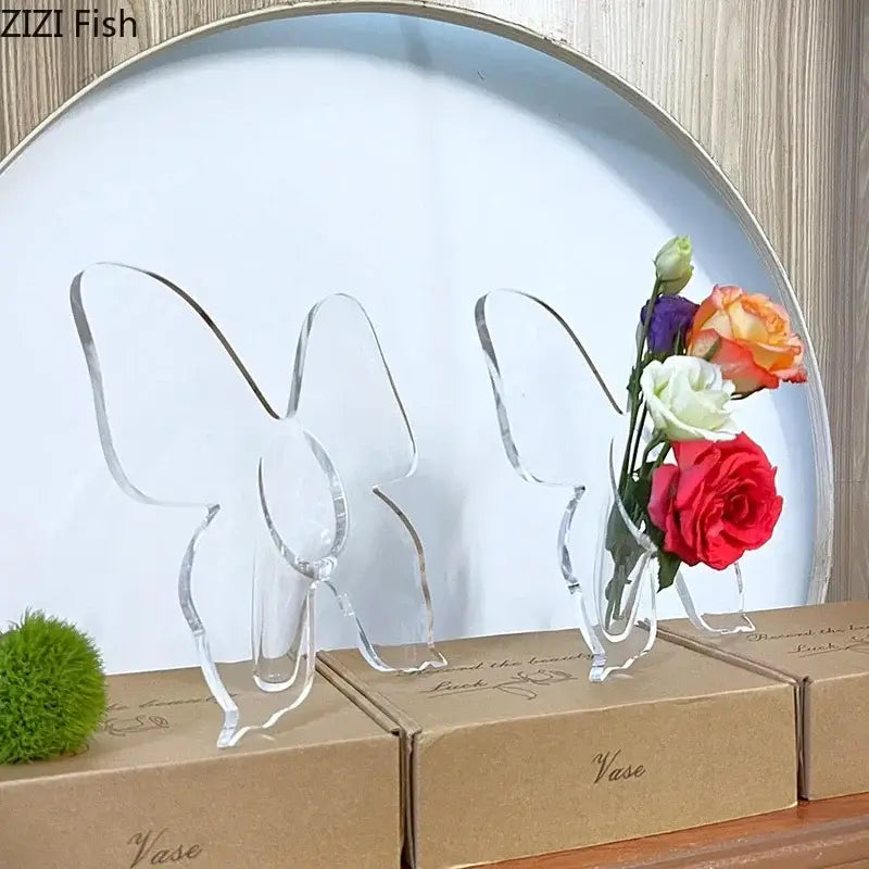 Clear acrylic decorbites butterfly vase holding a colorful bedroom flower arrangement pot