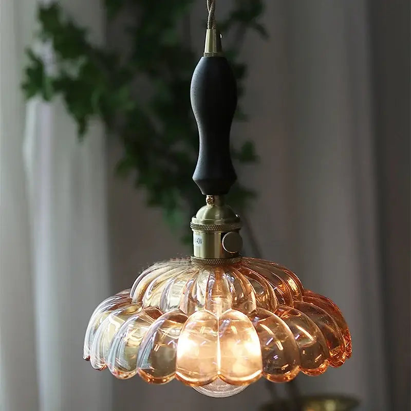 Clear and amber glass walnut pendant lamp with brass fixture and dark wood handle featuring decorbites amber glass design