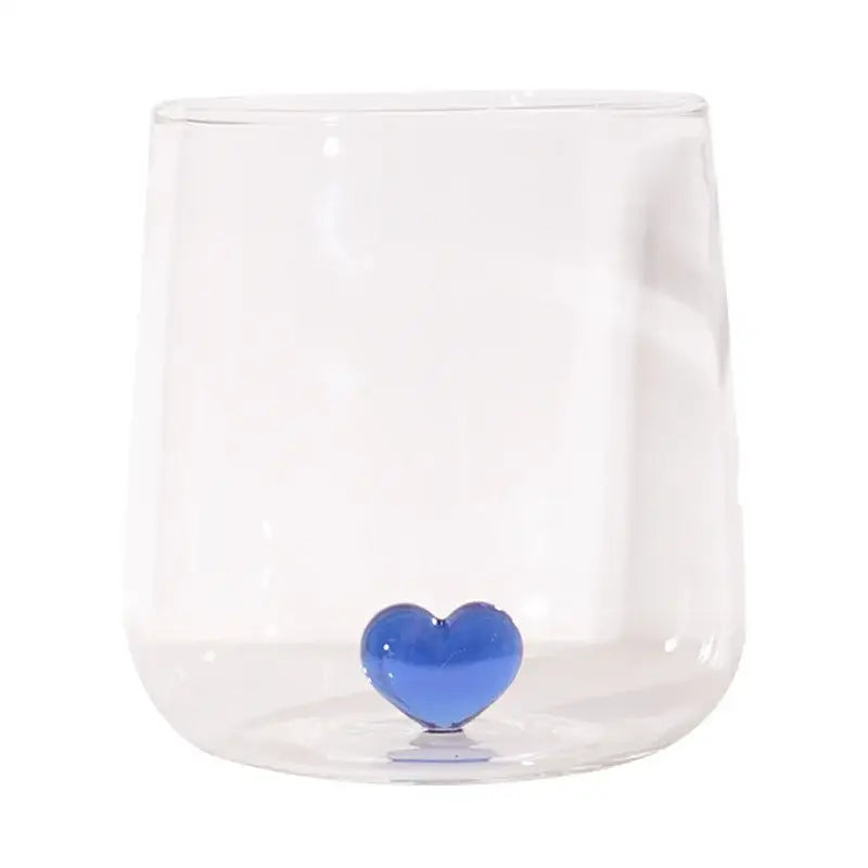 Clear glass tumbler mug with a glossy blue decorbites 3d heart accent at the base ideal as a kitchen glassware gift