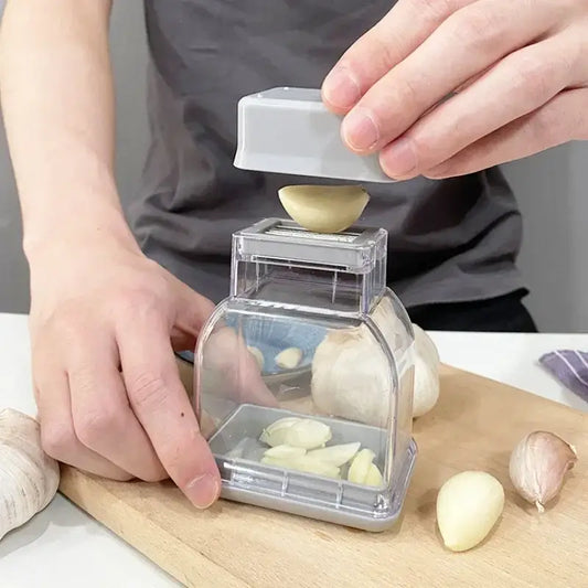 Clear and gray decorbites garlic grinding grater cutter made of clear plastic for easy crushing and peeling of cloves