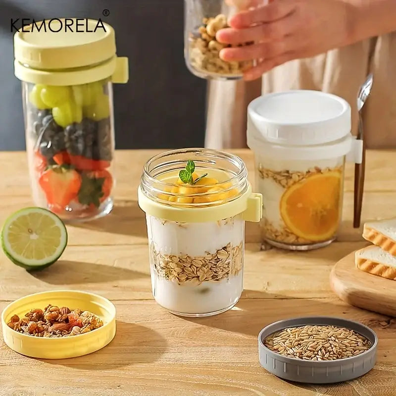 Clear borosilicate drinking glass jar with yellow lid and handle filled with yogurt granola and mango slices in drinking glasses set