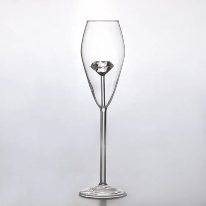 Clear diamond glass champagne flute with a faceted diamond ornament in the stem for elegant dining decorbites clear diamond