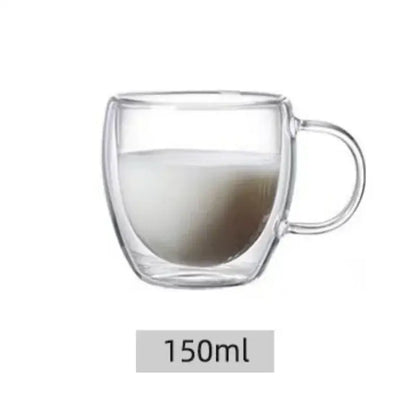 Clear double wall high borosilicate glass mug with handle containing layered milk and coffee for dining room use