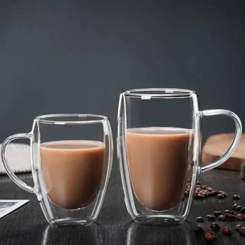 Clear double wall high borosilicate glass mug filled with brown liquid for coffee in dining room use