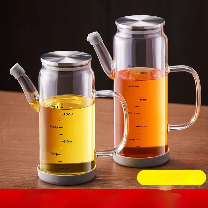 Clear glass and silver condiment bottle set with oil dispensers filled with golden-yellow and amber oils