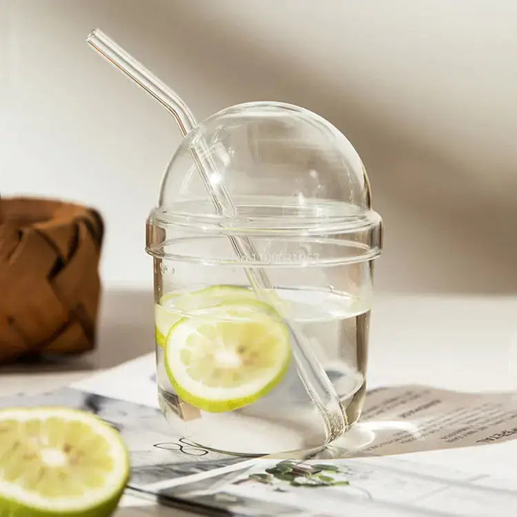 Clear glass bobo cup with ribbed lid and straw filled with lime water from decorbites clear glass milkshake set