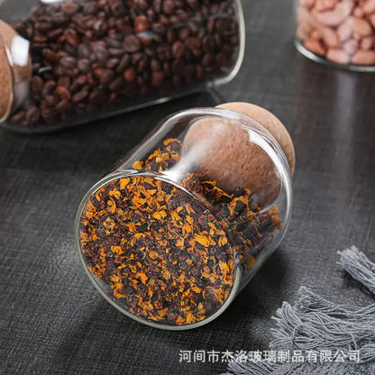 Clear glass bottle dispenser set with cork stoppers filled with dried orange and brown flower petals for decorbites glass bottle decor