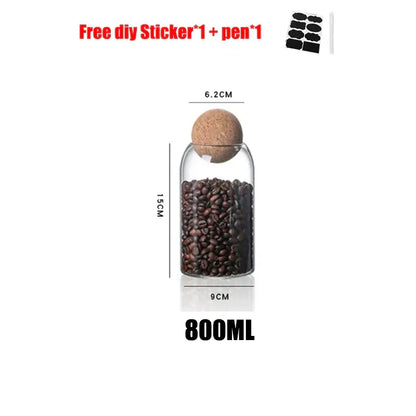 Clear glass bottle dispenser with natural cork stopper filled with dark roasted coffee beans from decorbites glass bottle set