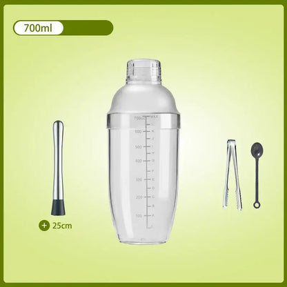 Clear glass cocktail shaker with silver lid and measurement markings, includes muddler, ice tongs, and bar spoon for beverage mixer
