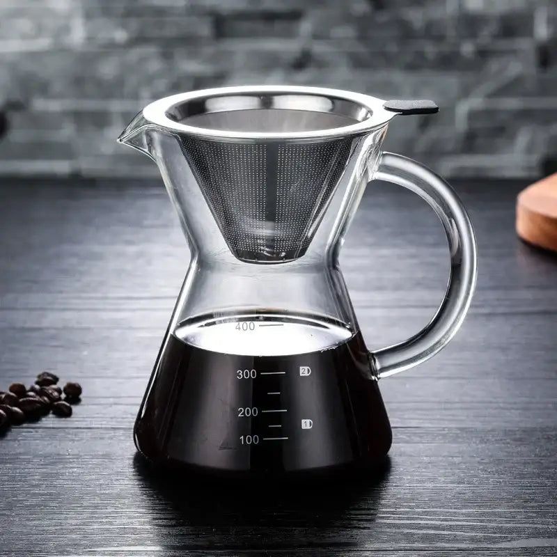 Clear glass coffee pot with stainless steel filter and measurement markings on the base for precise brewing