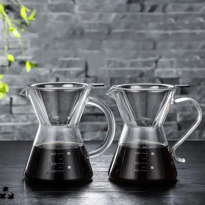 Two clear glass coffee pots with stainless steel filter and measurement markings filled with dark brewed coffee